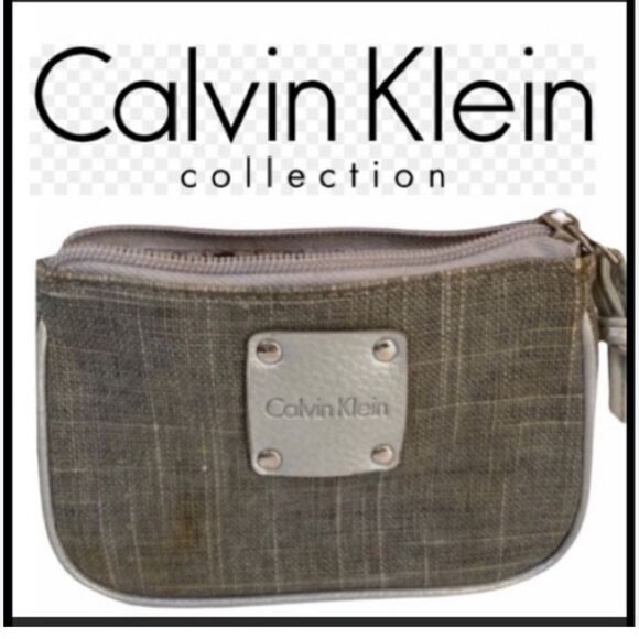 Calvin Klein Handbags - Calvin Klein clutch, silver, excellent condition